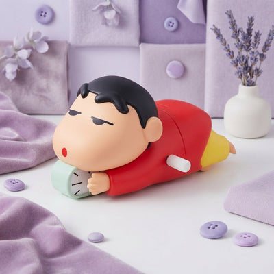 Shinchan crawling toy displayed on a clean white surface with soft lavender and lilac accents.